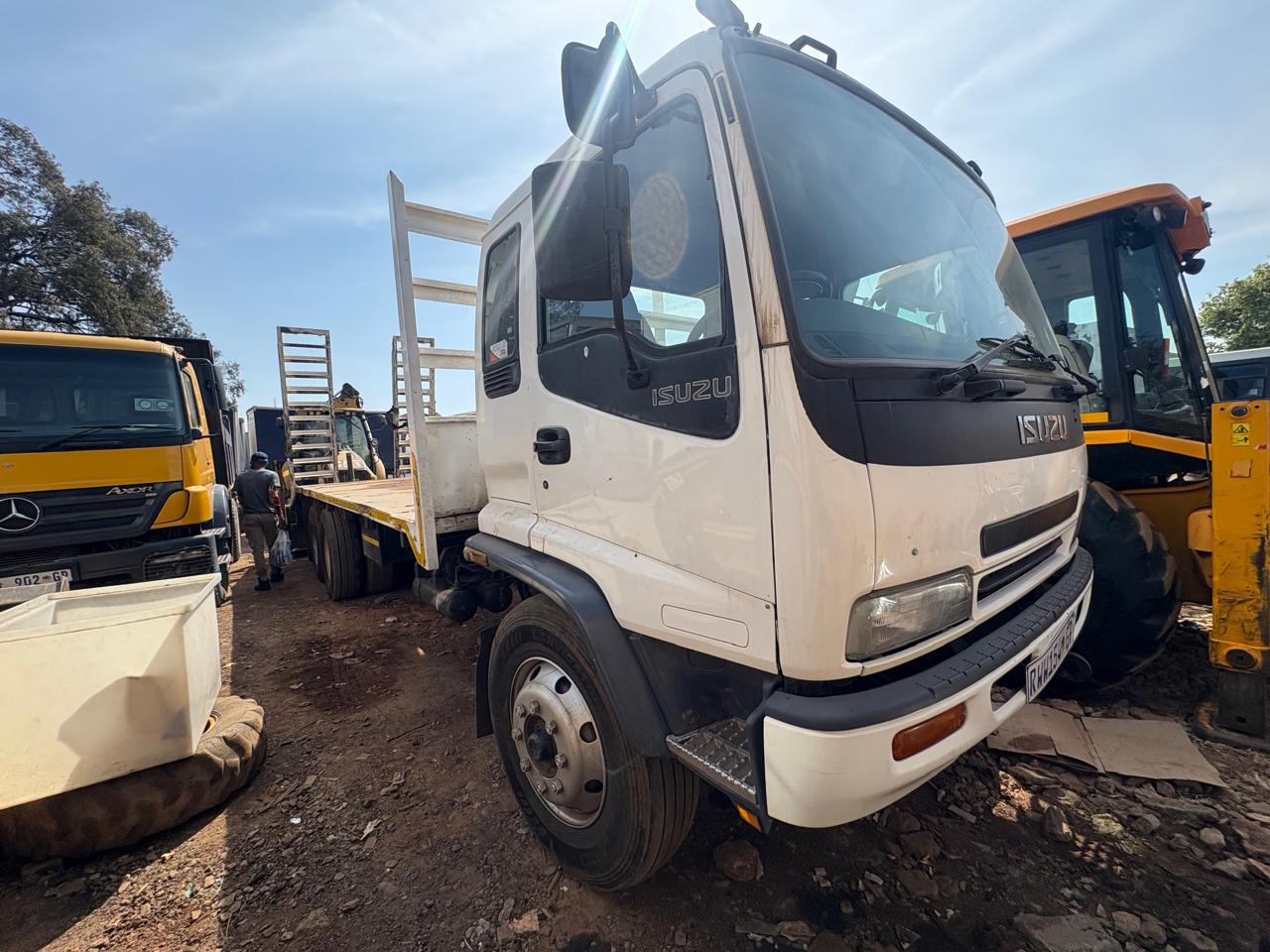 Isuzu flatbed transport truck